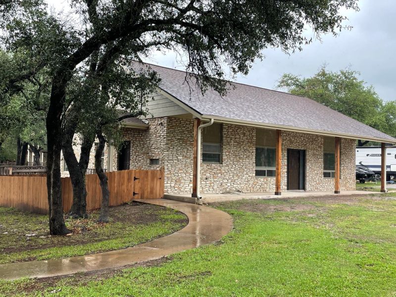 a home with a new roof following a fire damage restoration project completed in Austin, TX