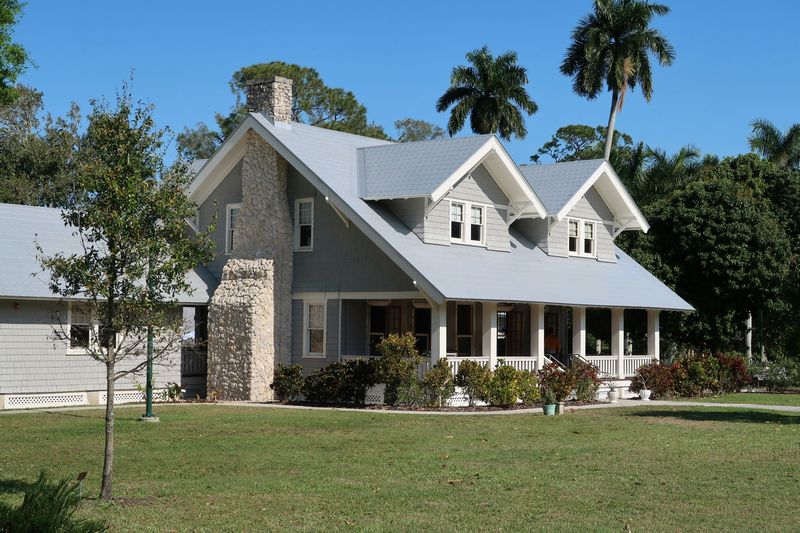 a residential home in Texas with a metal roof replacement