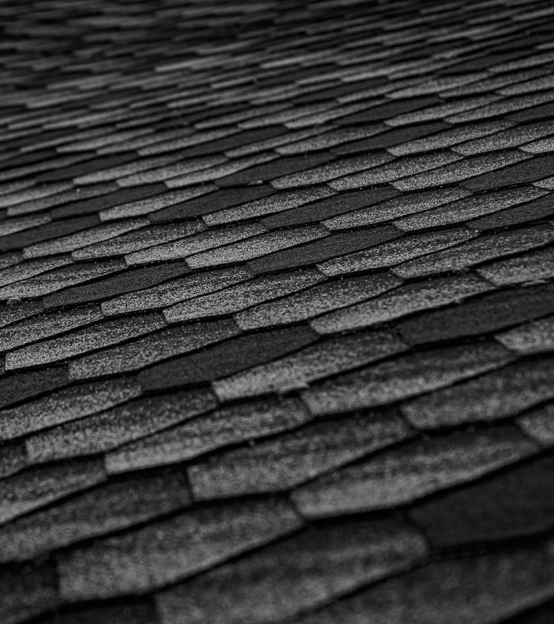 closeup of an asphalt shingle roof replaced as part of an insurance claim for hail damage in Austin, TX